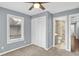 Bright bedroom with neutral walls, carpet, and a large closet at 628 N Beville Ave, Indianapolis, IN 46201