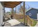 Covered deck with seating and grill area at 628 N Beville Ave, Indianapolis, IN 46201