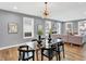 Modern dining room with glass table and chandelier at 628 N Beville Ave, Indianapolis, IN 46201