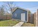 Detached garage with pathway and lawn at 628 N Beville Ave, Indianapolis, IN 46201