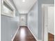 Long hallway with gray walls and wood flooring at 628 N Beville Ave, Indianapolis, IN 46201