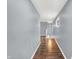 Gray hallway with wood flooring and access to upper level at 628 N Beville Ave, Indianapolis, IN 46201