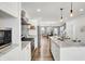 Open concept kitchen with white cabinets, granite countertops, and stainless steel appliances at 628 N Beville Ave, Indianapolis, IN 46201