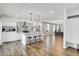 Open concept kitchen with white cabinets, granite island, stainless steel appliances at 628 N Beville Ave, Indianapolis, IN 46201