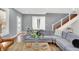 Living area with sectional sofa and hardwood floors at 628 N Beville Ave, Indianapolis, IN 46201