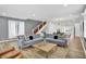 Open living room with hardwood floors and staircase at 628 N Beville Ave, Indianapolis, IN 46201
