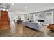 Open concept living room with hardwood floors and kitchen view at 628 N Beville Ave, Indianapolis, IN 46201