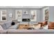 Living room with sectional sofa, fireplace, and hardwood floors at 628 N Beville Ave, Indianapolis, IN 46201