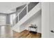 Modern staircase with metal and white wooden railings at 628 N Beville Ave, Indianapolis, IN 46201