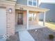 Inviting front porch with brick pillars, perfect for enjoying the outdoors at 6123 Card Blvd, Indianapolis, IN 46221