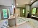 Spa bathroom with walk-in shower, double vanity, and access to the outdoor deck at 6438 Pin Oak Dr, McCordsville, IN 46055
