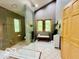 Serene bathroom with a glass enclosed shower, bench, and backyard nature view at 6438 Pin Oak Dr, McCordsville, IN 46055