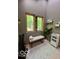 Relaxing bathroom space with water feature, decorative shelves and a tiled floor at 6438 Pin Oak Dr, McCordsville, IN 46055