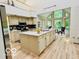 Well-lit kitchen features stainless steel appliances and a spacious island at 6438 Pin Oak Dr, McCordsville, IN 46055