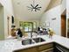 Open-concept living room with vaulted ceilings, large windows and a sliding door to deck at 6438 Pin Oak Dr, McCordsville, IN 46055