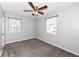 Bright bedroom featuring neutral walls, a ceiling fan and two windows at 1902 N Bancroft St, Indianapolis, IN 46218