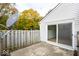 Backyard patio features a sliding door and a weathered privacy fence at 6072 Wingedfoot Ct, Indianapolis, IN 46254