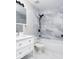 Stylish bathroom featuring modern fixtures, updated tile work, and a shower/tub combo at 6072 Wingedfoot Ct, Indianapolis, IN 46254