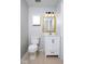 This renovated bathroom has a new vanity, toilet, and light fixture at 6072 Wingedfoot Ct, Indianapolis, IN 46254