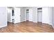 Spacious bedroom with hardwood floors, a double door closet, and lots of storage at 6072 Wingedfoot Ct, Indianapolis, IN 46254