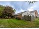 Residential brick and vinyl home with large front lawn and mature shade trees at 6072 Wingedfoot Ct, Indianapolis, IN 46254