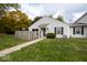 Charming home with a well-manicured lawn and inviting walkway to the front entrance at 6072 Wingedfoot Ct, Indianapolis, IN 46254