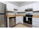 Well-equipped kitchen with stainless steel appliances and ample cabinet space at 6072 Wingedfoot Ct, Indianapolis, IN 46254
