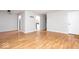 Spacious living room area featuring wood floors and neutral walls at 6072 Wingedfoot Ct, Indianapolis, IN 46254