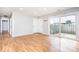 Bright living room with wood floors and sliding glass door to the outdoor patio at 6072 Wingedfoot Ct, Indianapolis, IN 46254