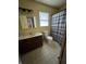Bathroom with vanity, toilet, and shower with curtain; features yellow walls at 3231 W State Road 32, Westfield, IN 46074