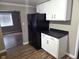 Kitchen view showcasing white cabinets, black countertops, and appliances at 309 S Fleming St, Indianapolis, IN 46241