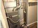 Close-up of mechanical equipment, including furnace and water heater at 309 S Fleming St, Indianapolis, IN 46241