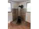 Efficient black wood burning stove is the focal point of this corner space with tile detail at 184 Lake Hart, Mooresville, IN 46158