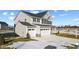 Two-story home with gray siding, white trim, and a two-car garage at 230 Mcnair Rd, Whiteland, IN 46184