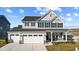 Two-story home with gray siding, white trim, and a two-car garage at 230 Mcnair Rd, Whiteland, IN 46184