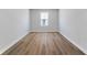 Simple bedroom with wood-look flooring and window at 420 Charles Freer Ln, Whiteland, IN 46184