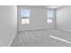 Spacious bedroom with gray carpeting and large windows at 420 Charles Freer Ln, Whiteland, IN 46184