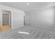 Bedroom with gray carpet, walk-in closet, and additional door at 420 Charles Freer Ln, Whiteland, IN 46184