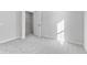 Bright bedroom with grey carpet, a window, and walk-in closet at 420 Charles Freer Ln, Whiteland, IN 46184