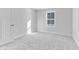 Spacious bedroom with grey carpeting and a window at 420 Charles Freer Ln, Whiteland, IN 46184