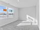 Bright bedroom with grey carpet and large window at 420 Charles Freer Ln, Whiteland, IN 46184