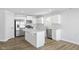 Modern kitchen with island and white shaker cabinets at 420 Charles Freer Ln, Whiteland, IN 46184