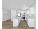 Open concept kitchen with island and stainless steel appliances at 420 Charles Freer Ln, Whiteland, IN 46184