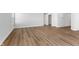 Bright living room featuring wood-look flooring at 420 Charles Freer Ln, Whiteland, IN 46184