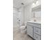 Bathroom featuring a gray vanity, shower and tub at 432 Charles Freer Ln, Whiteland, IN 46184