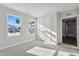 Well-lit bedroom featuring gray carpeting and double doors at 432 Charles Freer Ln, Whiteland, IN 46184
