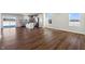 Open concept kitchen and dining area with dark hardwood floors at 432 Charles Freer Ln, Whiteland, IN 46184