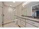 Modern bathroom features double sinks, white cabinetry, and large glass-enclosed shower at 504 N Park N Ave # 4, Indianapolis, IN 46202