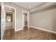 Bedroom featuring modern lighting, hardwood floors, and adjoining closet and bathroom at 504 N Park N Ave # 4, Indianapolis, IN 46202