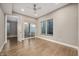 Relaxing bedroom with hardwood floors, large window, and sliding door to outdoor patio at 504 N Park N Ave # 4, Indianapolis, IN 46202